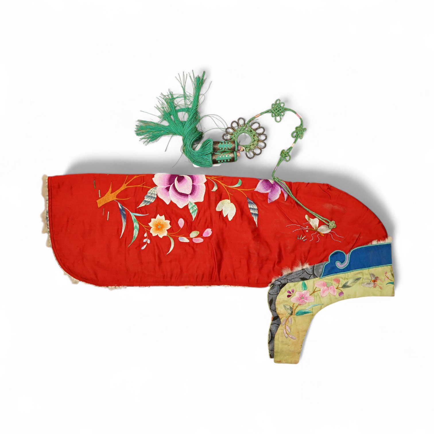 A 20th century possibly Miao, child’s multi coloured silk embroidered and padded winter hood, with fur trim and ornate tasselled decoration, 54cm long. Condition - the light green silk edge has worn and has lightly disco